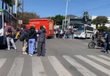 Normal school students and workers from the UABJO block main roads in the city of Oaxaca