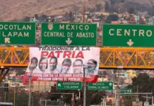 In a style reminiscent of drug cartels: banners bearing the names of legislators appear after they vote against electoral reform in Oaxaca.
