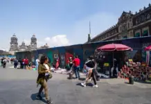 Fences reinforce security around Mexico City’s Zócalo ahead of the March 8th march; businesses and hotels are being protected.
