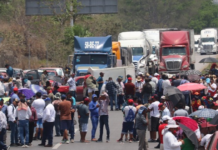 They block the road and demand support.
