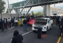 Student teachers block Mexico-Cuernavaca highway toll booth.