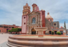 You explore this Pueblo Mágico in Querétaro with a glass of wine and a gordita de migaja in hand.