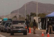 A long line of trailers reaches kilometer 164 towards the Cucapah military checkpoint.