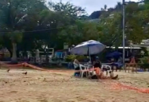 Tourists prevented from setting up on the stretch of sand at Manzanillo Beach.